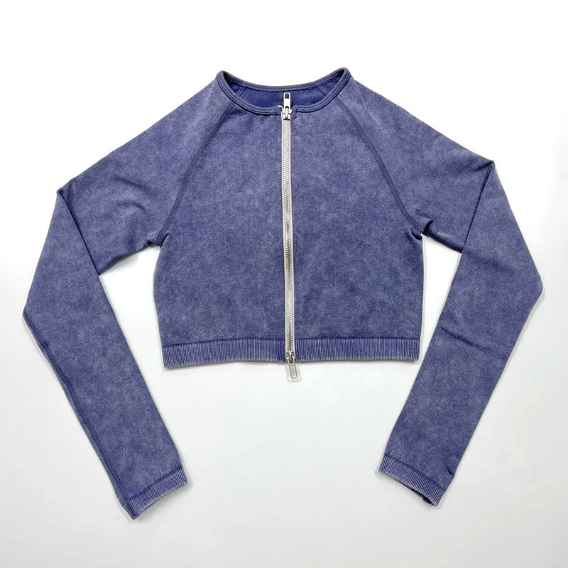 Blue long-sleeve crop top with a zipper on a white background
