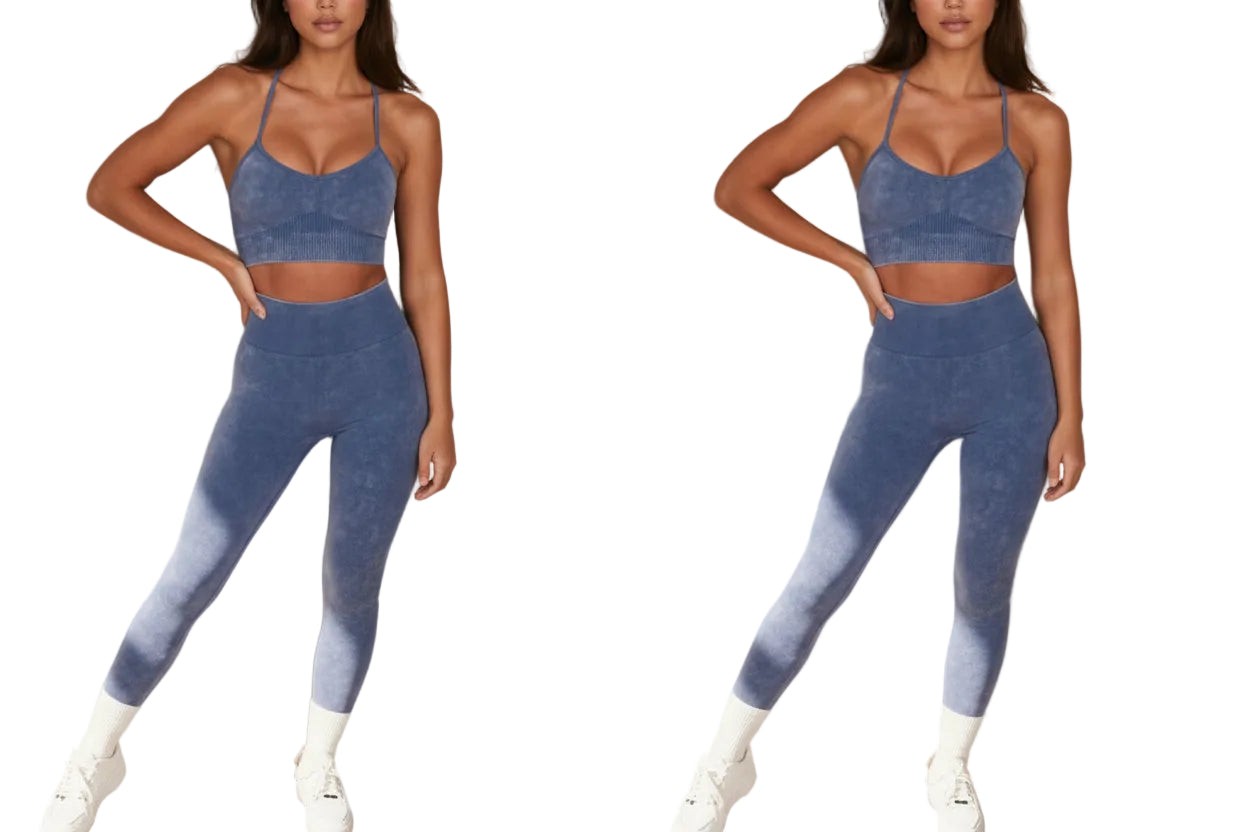 Woman wearing a blue athletic outfit with a sports bra and leggings against a neutral background.