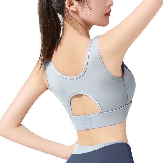 Light blue sports bra worn by a person on a plain background